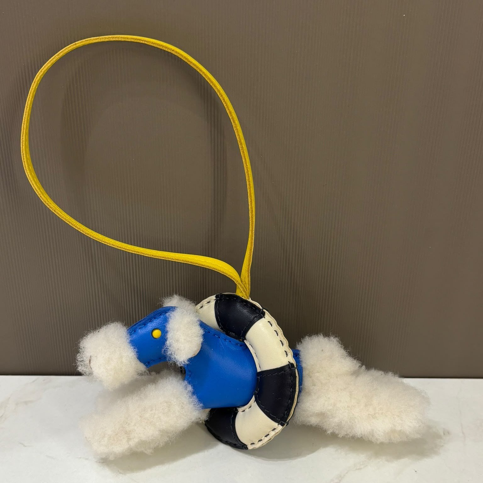 hermes-ala-mer-buddy-charm-hero-photo Hermès A La Mer Buddy Charm, Bleu Hydra / Jaune de Naples / Bleu Nuit / Craie