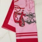 Hermès Brides de Gala double face silk scarf 90 in rose and rouge, folded