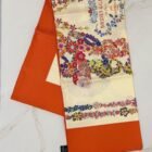 Hermès Brides de Gala en Fleurs silk scarf 90, folded with vermilion border