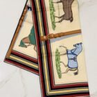 Hermès Couvertures et Tenues de Jour Forever silk scarf 90, folded with striped border
