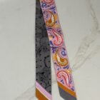 Hermès Guepards Bandana Twilly Single in rose, gris and bleu silk, laid flat
