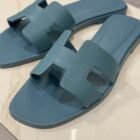 Hermès Oran sandal in Bleu Mineral Epsom leather, close up of the H cut out strap
