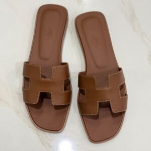Hermès Oran sandals in Gold Swift leather with contrast stitching, size 37.5, from above