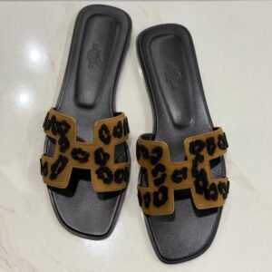 Hermès Oran sandals in leopard with black footbed, size 39, from above