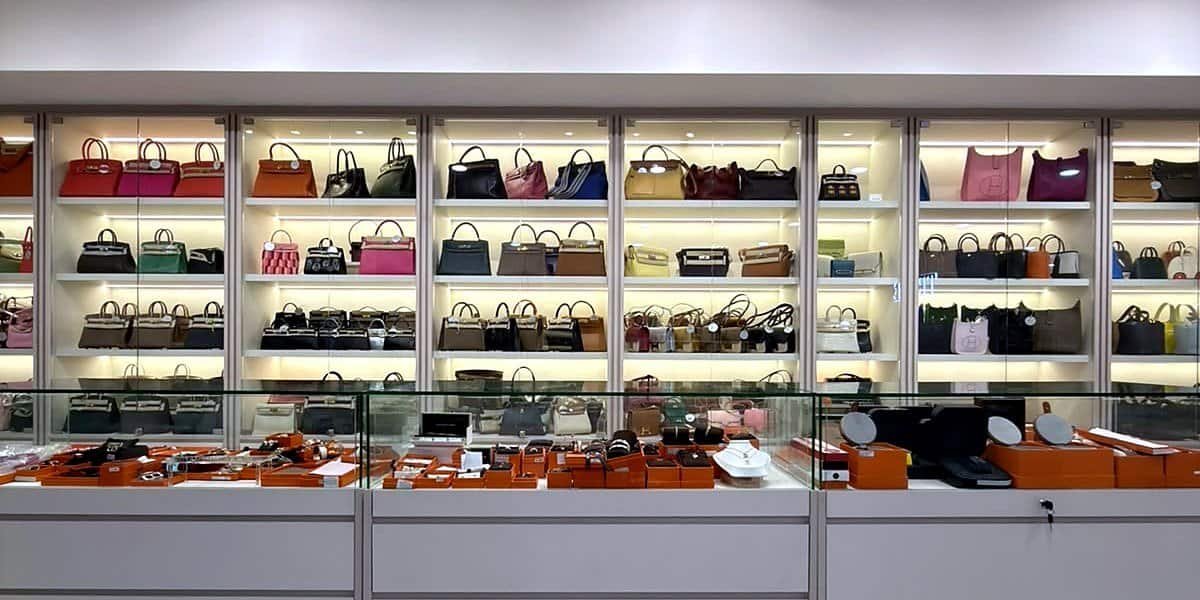Lit display cabinets of Hermès Birkin, Kelly and Evelyne bags at the TROVE by SGD store, Orchard Road
